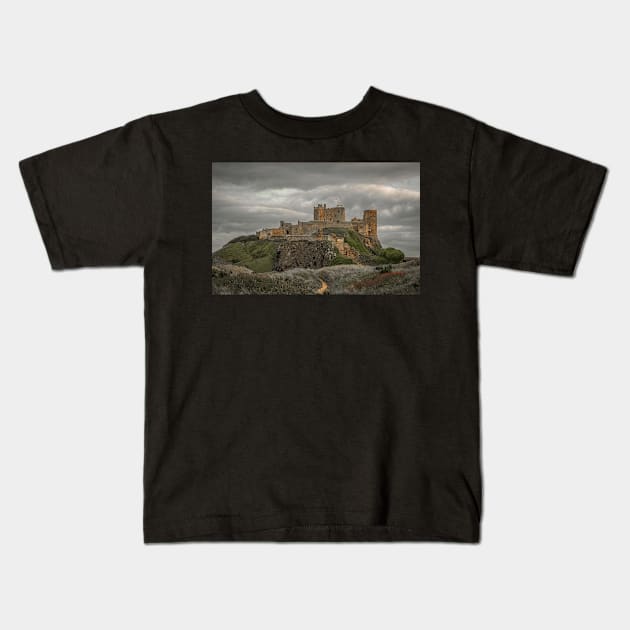 Bamburgh Castle Northumberland Kids T-Shirt by tynesidephotos